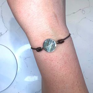 Dream bracelet on leather cord